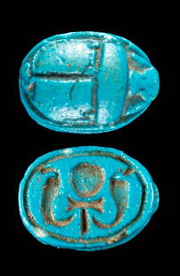 Superb Egyptian Faience Scarab Pendant w/ Ankh & Uraei: Ancient Egypt, New Kingdom, 18th to 20th Dynasty, ca. 1550 to 1077 BCE. A mold-formed faience scarab pendant from the New Kingdom period, covered in lustrous layers of brilliant blue glaze. The top