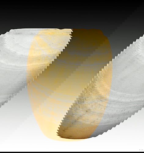 An Egyptian Alabaster Jar: Old Kingdom, 4th-8th Dynasty, 2575-2134 B.C. Banded alabaster vessel of ovoid form, lip delineated by a smooth groove, the body tapering to a small flat base, with an offset rounded rim. 3-5/8"H (9.2c