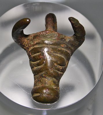 A Luristan Bronze Bull's Head Pendant: From Iran, ca. 8th to 7th century BC. Solid bronze amulet / pendant in the shape of a bull's head with loop for suspension. 1-1/4"L. Provenance: ex-private Canadian collection, ex Yoav Sasson, Jerusal