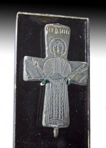 A Byzantine Bronze Reliquary Cross: Byzantium, ca 600 to 1000 AD. Front half of a reliquary cross, standing figure of Christ, arms outstretched, inscription above in Greek Cyrillic text, clasp at base. 3"H. Provenance: Ex-Newton Estate,