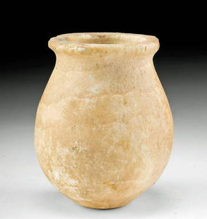 Egyptian Banded Alabaster Jar: Egypt, Late Dynastic Period, 26th to 31st Dynasty, ca. 664 to 332 BCE. A beautiful jar of utilitarian form that is hand-carved from creamy honey-yellow alabaster with opaque white veining throughout.