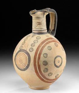 Cypriot Polychrome Trefoil Oinochoe w/ Bullseye Motifs: Ancient Greece, Cyprus, Iron Age, Cypro-Archaic Phase, ca. 1st millennium BCE. An impressive pottery vessel, striking for both its attractive form with a near-spherical body, a narrow neck, a trefoil