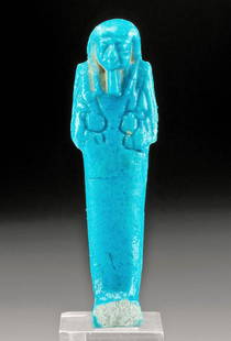 Egyptian Glazed Faience Ushabti w/ Fine Blue Hue: Egypt, Late Dynastic Period, 26th to 31st Dynasty, ca. 664 to 332 BCE. A hand-built faience ushabti of a petite size that is covered in lustrous blue glaze. The minimalist figure stands in mummiform