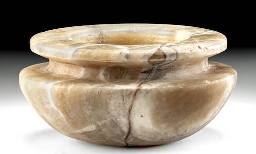 Impressive Egyptian Old Kingdom Alabaster Bowl: Ancient Egypt, Old Kingdom, 3rd to 6th Dynasty, ca. 2686 to 2181 BCE. A beautiful bowl carved from a sizable piece of alabaster stone with thick walls. The vessel is formed with a slightly flat base