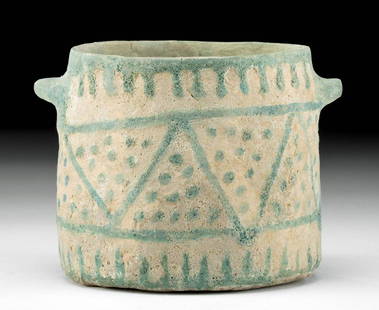 Rare Egyptian Glazed Faience Jar w/ Geometric Motif: Ancient Egypt, New Kingdom to Third Intermediate Period, 18th to 25th Dynasty, ca. 1550 to 664 BCE. A rare and remarkable Egyptian faience jar presenting a flat circular base and thin walls that