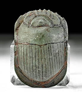 Egyptian New Kingdom Graywacke Heart Scarab: Ancient Egypt, New Kingdom, 18th to 20th Dynasty, ca. 1550 to 1070 BCE. A lovely example of an ovoid heart scarab, hand-carved from dark green graywacke and presenting with pleasingly smooth