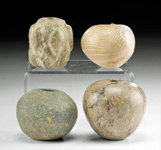 4 Egyptian Pre-Dynastic & Near Eastern Stone Mace Heads: Egypt, Pre-Dynastic Period, Naqada II, ca. 3500 to 3000 BCE; Ancient Near East, perhaps Bactrian, ca. 1st millennium BCE. A striking ensemble of 2 Egyptian and 2 Near Eastern stone mace heads all