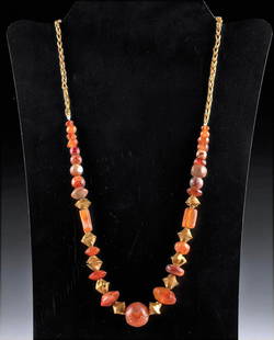 Ancient Egyptian Gold & Carnelian Necklace: Ancient Egypt, Third Intermediate to Late Dynastic Period, 21st to 26th Dynasty, ca. 1070 to 525 BCE. This is a stunning necklace made from 27 carnelian stones and 10 high quality 88% to 89%