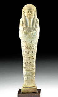 Tall Translated Egyptian Faience Ushabti for Psamtek: Ancient Egypt, Late Dynastic Period, 26th Dynasty, ca. 664 to 525 BCE. A fantastic faience ushabti figure of a tall, dignified form covered in pale turquoise glaze made for the overseer of the