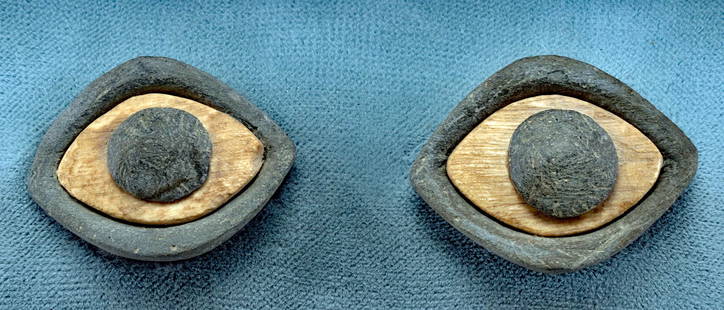 Mesopotamian Lapis Lazuli, Stone, & Bone Eyes: Ancient Near East, Mesopotamia, ca. 2900 to 2250 BCE. A haunting pair of eyes boasting white sclerae hand-carved from the bone of an ungulate with inlays of black stone pegs forming the pupils. Each