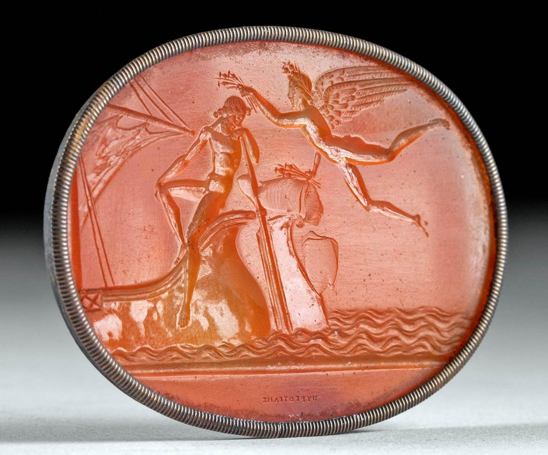 18th C. European Neoclassical Carnelian Intaglio: Western Europe, Neoclassical period, ca. 18th to early 19th century CE. A charming near-translucent carnelian intaglio depicting a hero lounging on the end of a ship, greeted by a goddess - perhaps Ja