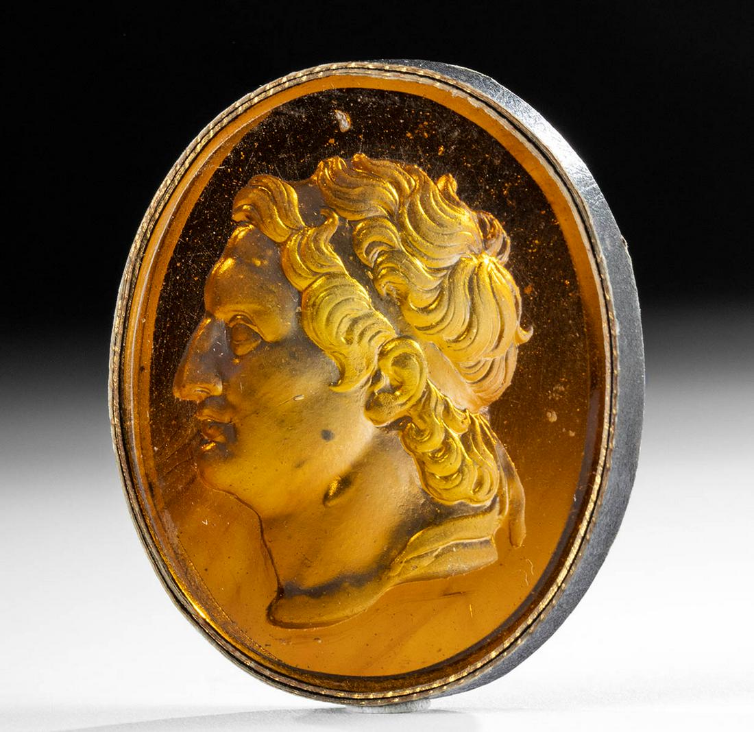18th C. Neoclassical Glass Intaglio Alexander the Great: **Originally Listed At $400** Northern Europe, Neoclassical period, ca. 18th to early 19th century CE. A handsome amber hued glass intaglio depicting a bust of Alexander the Great - presented with a y