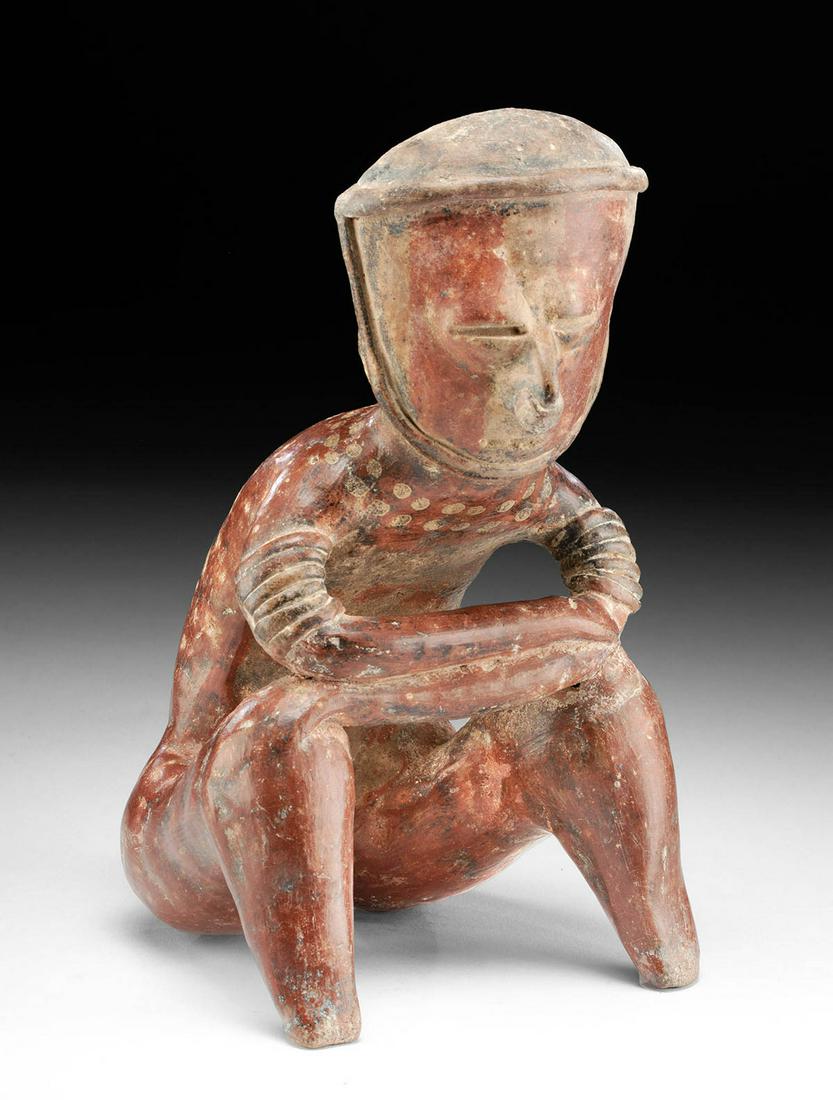 Nayarit Chinesco Type C Pottery Seated Male Figure: Pre-Columbian, Western Mexico, Nayarit, Chinesco, Type C, Protoclassic period, ca. 100 BCE to 250 CE. An impressive pottery figure of a male shown seated with legs bent before him and arms crossed and