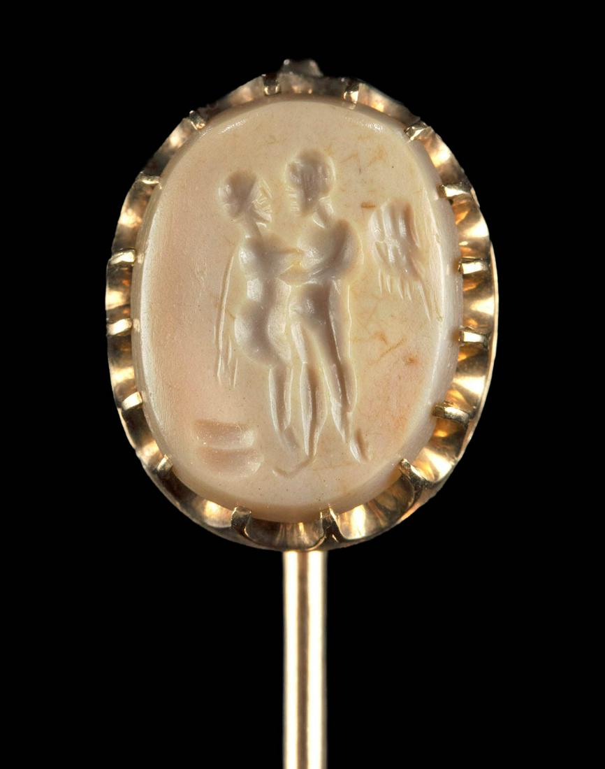 Neoclassical Gold Pin, Stone Intaglio, Eros & Psyche: Western Europe, probably England or France, Neoclassical Period, ca. 19th century CE. A beautiful tie pin of an elegant, slender form. The gold body features an openwork ovoid bezel with peaked filigr