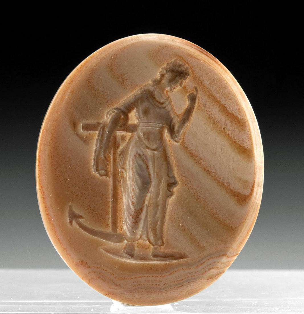 Neoclassical Agate Intaglio, Hope as Young Woman: Western Europe, Neoclassical, ca. 19th century CE. This is a lovely agate intaglio that is hand carved with the personification of Hope as a young woman. She leans against a large anchor and stands up