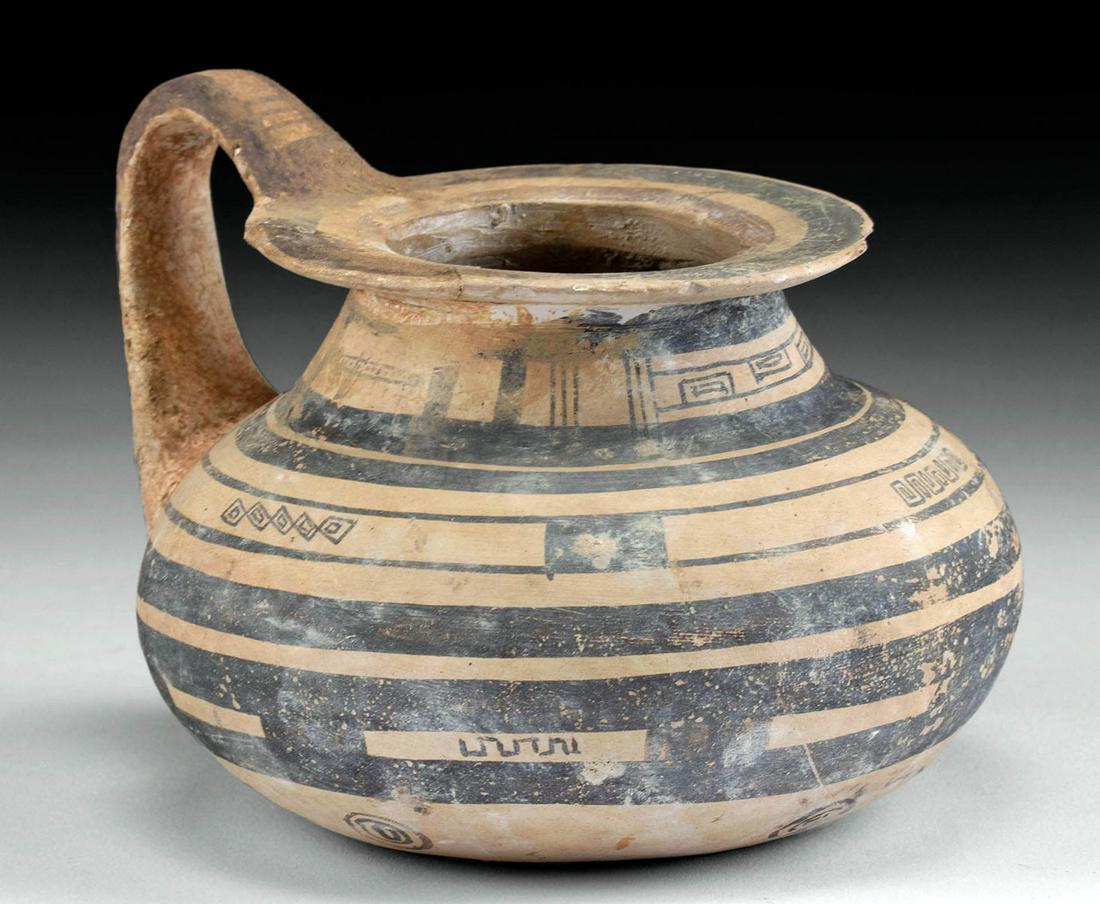 Daunian Bichrome Kyathos Banded / Geometric Motifs: Magna Graecia, Italy, Apulia / Daunian, ca. 4th century BCE. A charming example of a pottery dipping vessel known as a kyathos, presenting a bulbous body, a conical neck, a broad, flared rim, and a ri