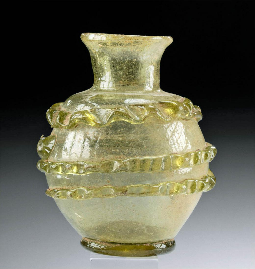 Stunning 18th C. Islamic Safavid Glass Ampulla: Near East, Persia, Safavid Dynasty, ca. 18th century CE. A stunning ampulla, free blown from light green glass to display a globular body, a round shoulder, a slender neck, and a flared rim, all sitti