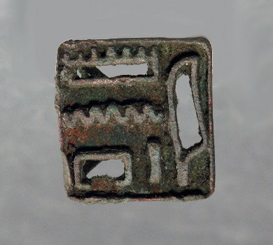 An Egyptian Bronze Karnak Temple Seal: Egypt, Late Dynastic, ca. 650 to 300 BC. Rare ancient bronze stamp, possibly for use in stamping pottery; with clear set of glyphs beneath a pyramidal housing. The hieroglyphs say, "per-Amun" literall