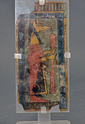 An Egyptian Cartonnage Fragment: From ancient Egypt, Late Dynastic Period, ca. 650 to 300 BC. Lovely, small fragment of an outer mummy cartonnage painted gesso over linen; with nice clear image of standing god Anubis – the jackal �