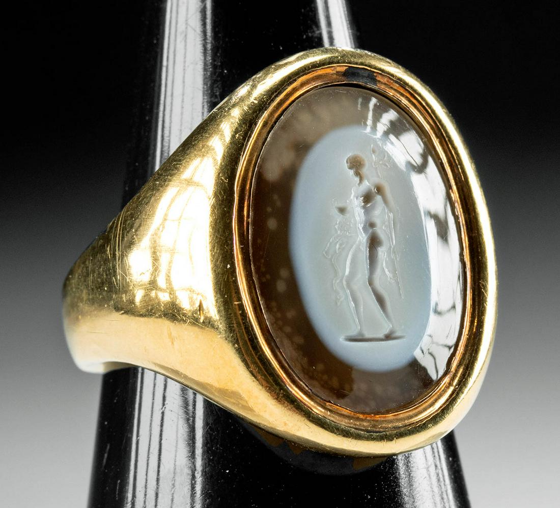 19th C. Neoclassical Gold Ring, Agate Intaglio Nude Man: Western Europe, Neoclassical Period formed from 77.96% gold. The minimalist shank extends upwards with terminals that expand to form the ovoid shank. Set within the bezel is a hand-carved brown agate 