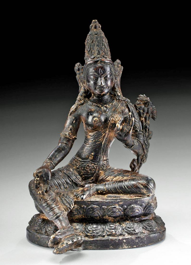18th C. Thai Brass Religious Tara Figure: Central Asia, Tibet, ca. 18th century CE. An impressive brass sculpture of the Green Tara or Shyamatara, a mother and savior goddess who offers protection from all dangers, seated in the relaxed lalit