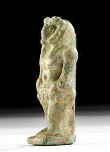 Egyptian Glazed Faience Amulet of Khnum: **First Time At Auction** Egypt, Late Dynastic Period, 26th to 31st Dynasty, ca. 664 to 332 BCE. A standing amulet of Khnum, the ram-headed god regarded as a guardian of the source of the Nile