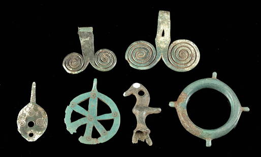 Greek Geometric Bronze Amulets & Pendants, 6 pcs: **Originally Listed At $250** Greece, Geometric Period, ca. 8th to 7th century CE. This is a collection of six bronze objects, cast into amulets, pendants, or tools. The disc shaped medallion with a