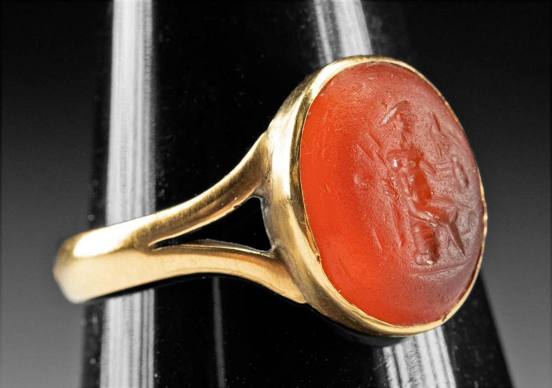 19th C. Gold Ring w/ Roman Carnelian Intaglio Mars: Roman, Imperial Period, ca. 1st to 3rd century CE; Western Europe, probably England or France, Neoclassical Period, ca. 19th century CE. An attractive ring of minimalist style with a Neoclassical gold