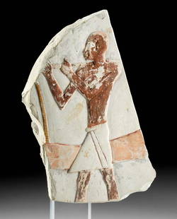 Egyptian Polychrome Limestone Panel w/ Male Figure: Ancient Egypt, Middle Kingdom, 11th to 13th Dynasty, ca. 2130 to 1649 BCE. An astounding limestone panel hand-carved in low relief to depict a male figure facing left, expertly hand-painted in hues