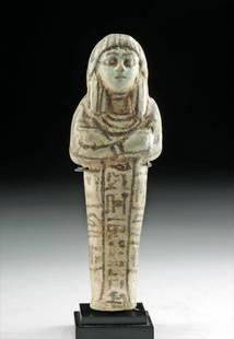 Egyptian Faience Ushabti for Ptah-Em-May, TL'd: Ancient Egypt, New Kingdom, late 19th Dynasty, ca. late 13th to early 12th century BCE. A gorgeous mold-formed faience ushabti covered in a layer of soft turquoise-hued glaze accentuated with applied