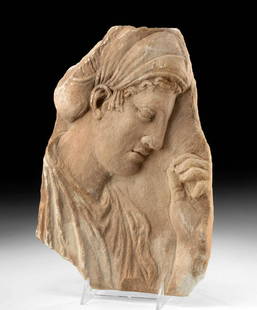 Greek Classical Marble Stele, Relief of Woman: Ancient Greece, Classical to Hellenistic Period, ca. 5th to 3rd century CE. A stunning marble funerary stele hand-carved to depict the relief of a woman in profile. Facing right, the solemn female