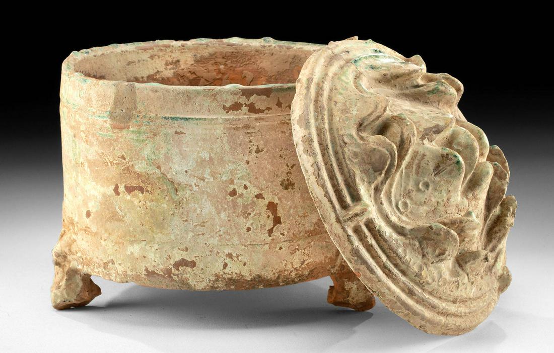 Chinese Han Pottery Tripod Lian Vessel w/ Mountain Lid: East Asia, China, Han Dynasty, ca. 206 BCE to 220 CE. A remarkable pottery tripodal vessel known as a lian or zun, with a molded mountain and/or lotus petal lid! The cylindrical body rests on 3 zoomor