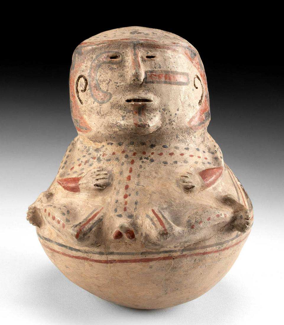 Casas Grandes Polychrome Figural Vessel, TL Tested: Pre-Columbian, Mexico, Chihuahua, Casas Grandes (also known as Paquime), ca. 12th to 13th century CE. A hand-built and beautifully painted human effigy vessel depicting a nude seated man with features