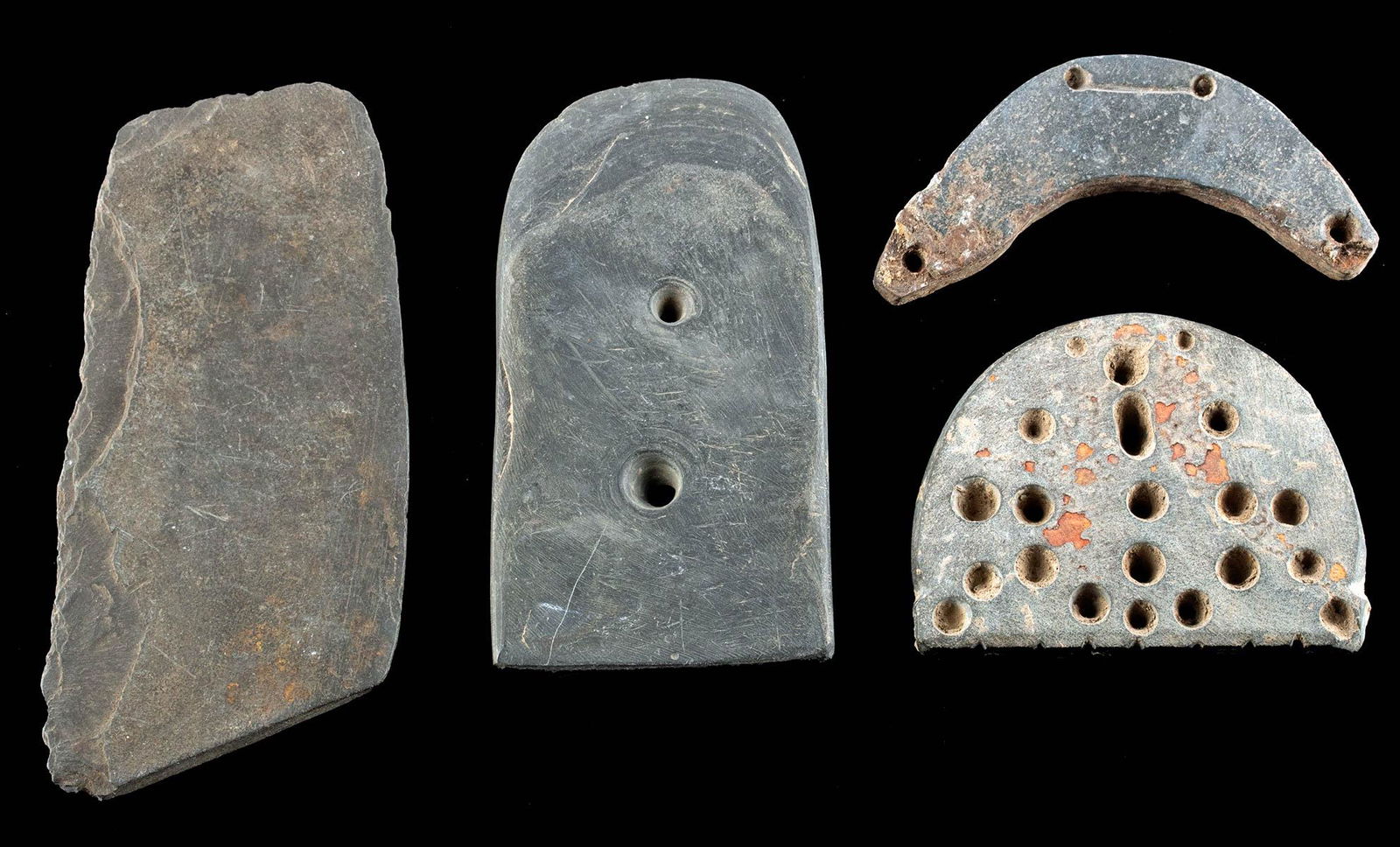 4 Prehistoric Hohokam Stone Tools & Gorget Pendants: Native American, Southwestern United States, Hohokam people, ca. 12th to 14th century CE. A collection of 4 worked slate stone gorget pendants and scraper tool. The gorgets each have hand drilled perf