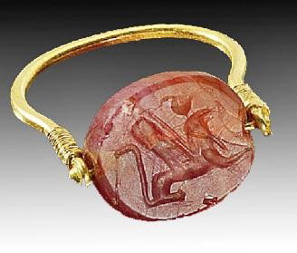 A Phoenician Gold Swivel Ring, Carnelian Scaraboid: Phoenicia, ca. 800 B.C. Solid gold ring with carnelian scaraboid, depicting a falcon headed sphinx. Size US 11 Provenance: German private collection, collected between 1950 – 1980. there is a reserv