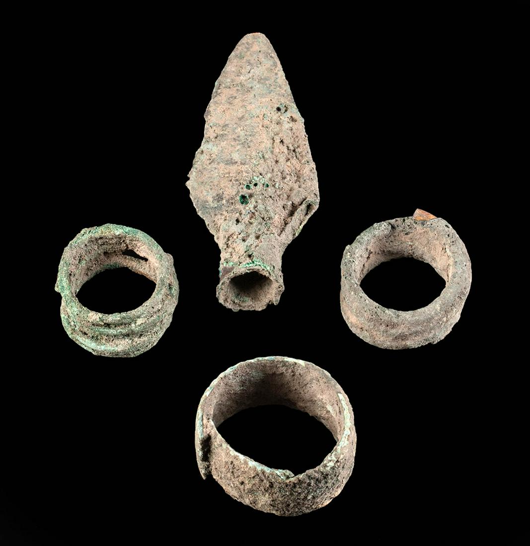 Lot of 4 Dong Son Bronze Pieces - Spearhead & Bracelets: **Originally Listed At $200** Ancient Southeast Asia, Vietnam, Dong Son culture, ca. late 1st millennium BCE. A fine group of bronze pieces from the Dong Son culture of ancient Vietnam. First is a pai