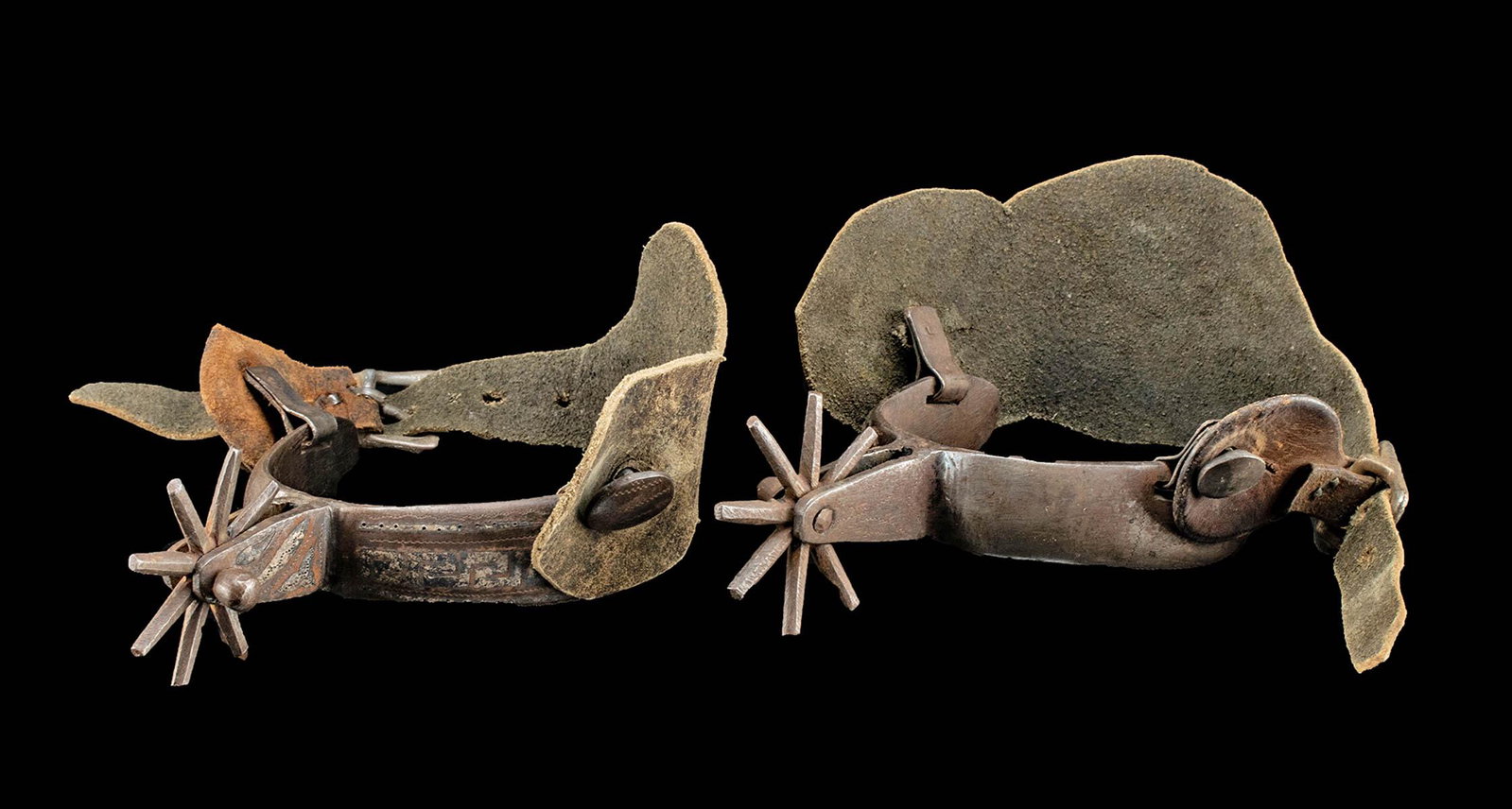 19th C. Mexican Steel, Leather, & Silver Spurs: **Originally Listed At $200** Latin America, Mexico, ca. late 19th to early 20th century CE. A wonderful pair of leather and steel Chihuahua style spurs inlaid with silver. The silver work forms a geo