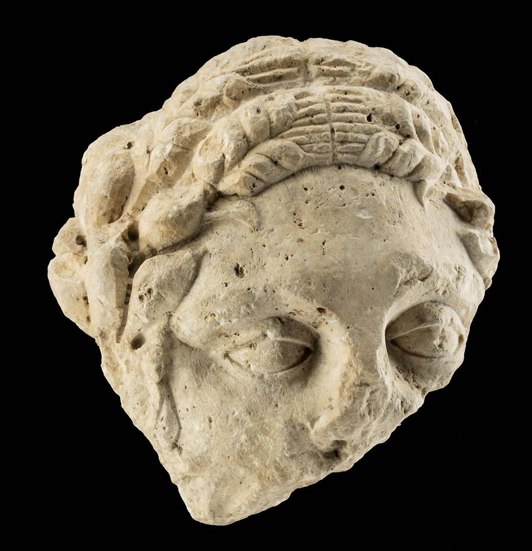 Lifesize Roman Limestone Head of Female (Relief): Roman, Imperial Period, ca. 1st to 3rd century CE. A beautiful life-sized fragment of a woman's head, perhaps a female fertility or vegetation personification such as Ceres (Greek Demeter) or Tellus (