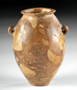 Egyptian Predynastic Breccia Jar, ex-Royal Athena: Ancient Egypt, Predynastic Period, late Naqada II to early Naqada III, ca. 3500 to 3200 BCE. An elegant jar, hand-sculpted from a single piece of truly stunning breccia stone with a variegated