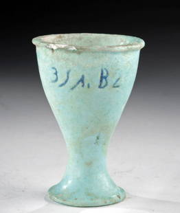 Egyptian Faience Vessel Demotic Symbols, ex-Christie's: Egypt, Late Dynastic to Ptolemaic Period, ca. 664 to 30 BCE. A beautiful mold-formed faience offering cup covered with glaze of a vivid sky-blue hue. The cup has a flared foot, a tapered pedestal