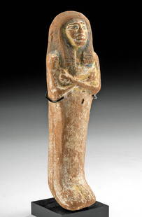 Egyptian New Kingdom Polychrome Ushabti: Ancient Egypt, New Kingdom, 18th to 20th Dynasty, ca. 1550 to 1077 BCE. A wonderful, mold-made pottery ushabti standing mummiform with fused legs and arms crossed at chest, all adorned in traces of