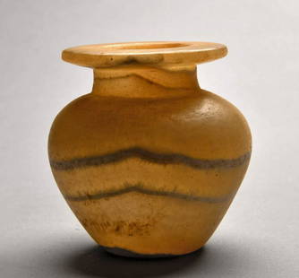 Egyptian Middle Kingdom Banded Alabaster Kohl Jar: Ancient Egypt, Middle Kingdom, 12th Dynasty, ca. 1991 to 1802 BCE. A beautiful example of a hand-carved banded alabaster kohl jar. Boasting attractive honey-yellow hues interspersed with opaque white