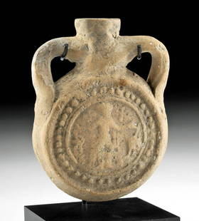 6th C. Egyptian Coptic Pottery Ampulla of Saint Menas: Egypt, Abu Mina, Coptic Culture, ca. 6th to 8th century CE. A delightful pottery pilgrim flask or ampulla presenting a flattened, discoid body adorned on each side with a decorative relief tondo of Sa