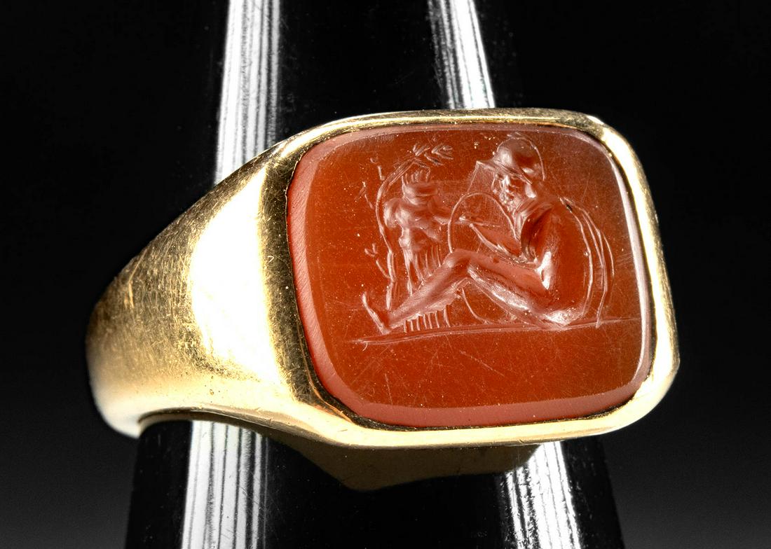 Neoclassical Gold Ring w/ Carnelian Intaglio, Othryades: **Originally Listed At $850** Western Europe, Neoclassical Period, ca. 19th century CE. A spectacular carnelian intaglio of rectangular form skillfully hand-carved with a reclining male soldier, likel