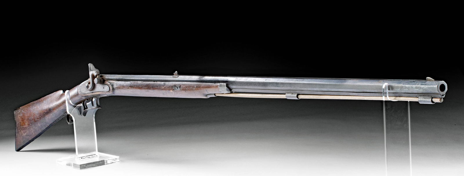 19th C. American Missouri Half Stock .50 Caliber Rifle: North America, United States, Missouri, ca. 19th century CE. A wooden and steel half stock .50 caliber rifle that has been converted from flint lock to percussion. This rifle features an octagonal bar