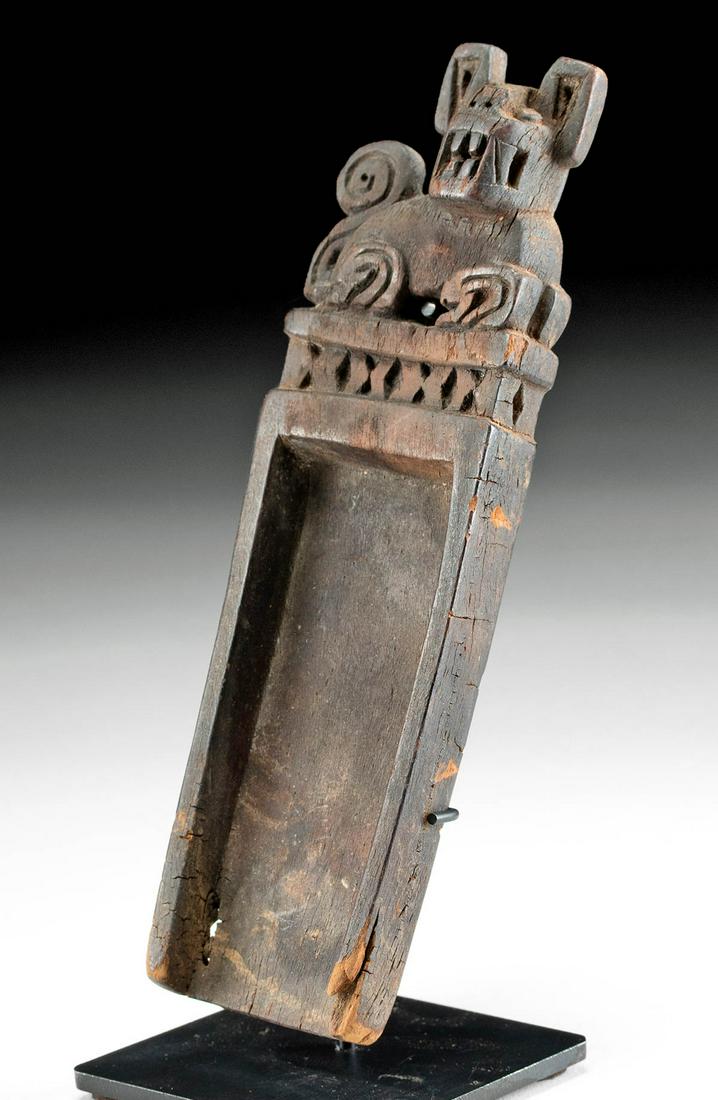 Tiahuanaco Wooden Snuff Tray w/ Jaguar Atop: Pre-Columbian, Chile, San Pedro, Atacama Desert, Tiahuanaco / Tiwanaku culture, ca. 4th to 8th century CE. A hand-carved wooden snuff tray of rectangular form that is surmounted by a stylized jaguar. 