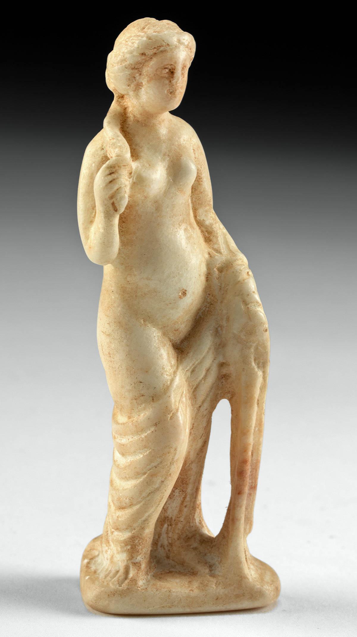 Roman Marble Statuette, Semi-Nude Venus Rising From Sea: Roman, Imperial Period, ca. 1st to 2nd century CE. The goddess of beauty herself! A gorgeous marble statuette of Venus - Greek Aphrodite - the Roman deity of love, beauty, and desire, depicted standin