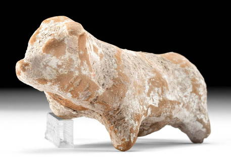 Greek Terracotta Votive Horned Bull: **Originally Listed At $250** Ancient Greece, ca. 6th century BCE. A zoomorphic terracotta votive figure in the form of a horned bull, formed using a bivalve mold. The animal is depicted with a