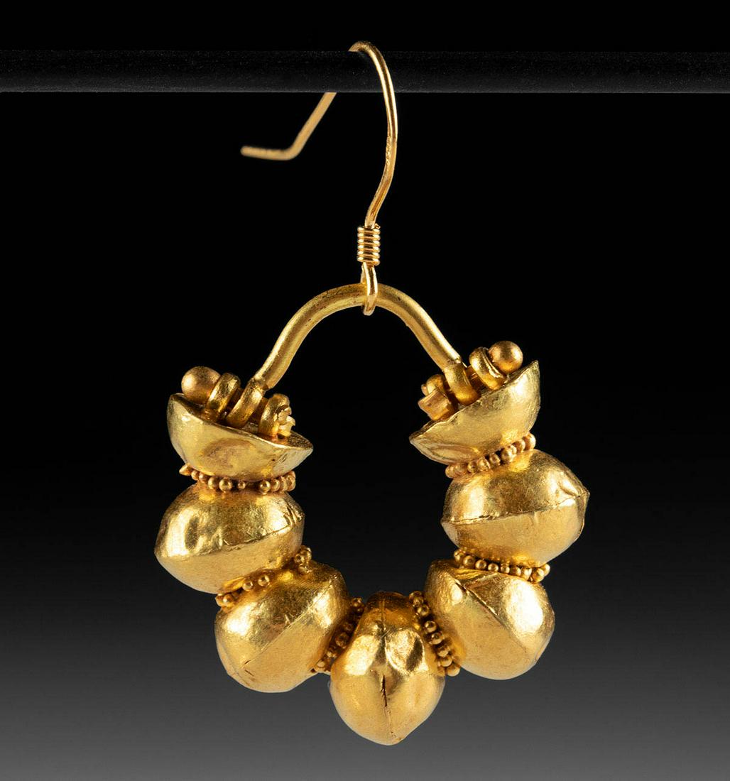 Roman 22K+ Gold Earring w/ Orbs: Roman, Imperial period, ca. 1st to 4th century CE. An opulent piece of Roman material culture; a beautiful earring comprised of gold spherical baubles resembling bells, all separated by bands of petit
