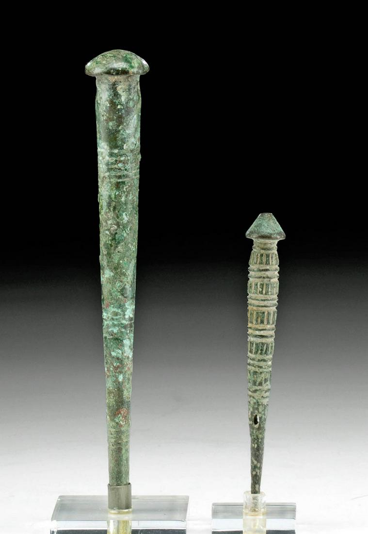 Ancient Luristan Leaded Bronze Cloak Pins (pr): Originally listed at $300 Ancient Near East, northwestern Iran and northeastern Turkey, Luristan, ca. 1000 to 600 BCE. A remarkable pair of cloak pins, 1 of leaded bronze and the other of copper alloy